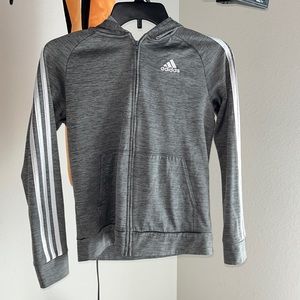 Zip up jacket from the brand Adidas.